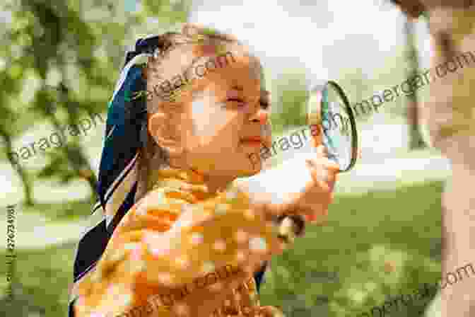 Curious Child Exploring A Magnifying Glass THE WHOLE CHILD: COGNITIVE EMOTIONAL SOCIAL